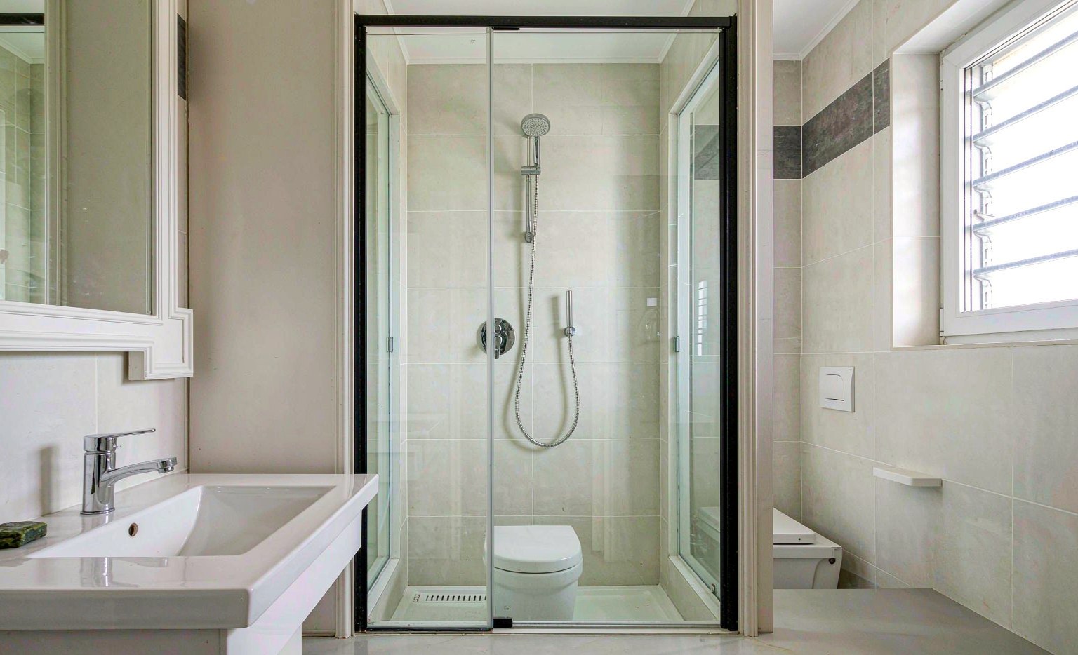 Modern bathroom with a frameless glass shower enclosure