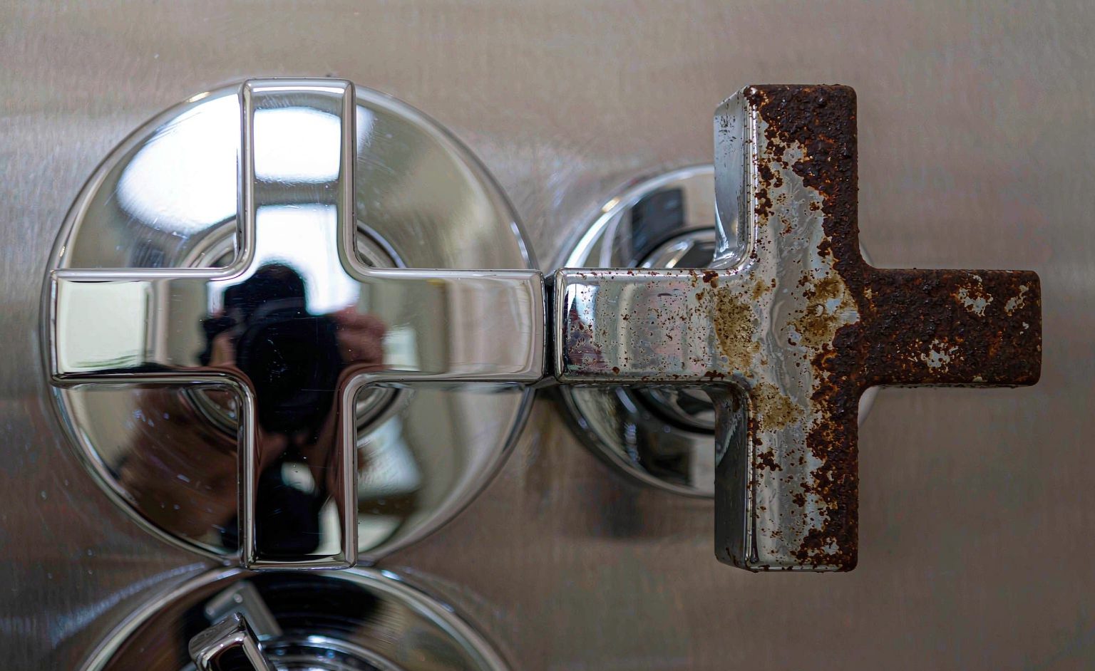 Corrosion Test Result Comparison Chrome plated shower hardware samples after corrosion testing with light rust spots